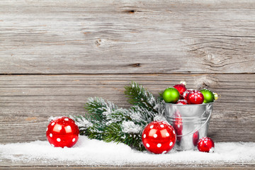 Christmas decoration with xmas canes, over wooden background