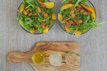 Vitamin salad- rucola with fruits and nuts. Top view