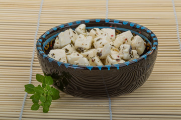 Cheese with spices and oil