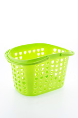 Shopping plastic basket isolated on white background