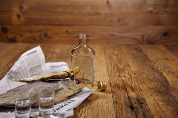 Russian snack . Vodka and dried fish