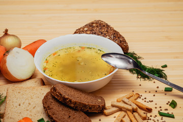 broth with bread and vegetables