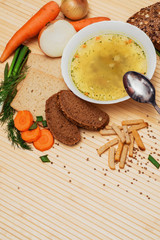 broth with bread and vegetables