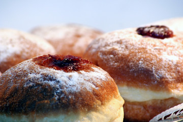 Sweet donuts on plate close up