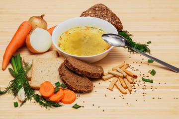 broth with bread and vegetables