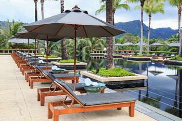 sun loungers stand at the pool and beautiful view