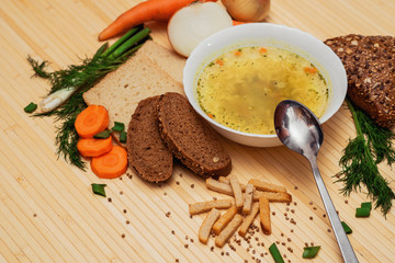 broth with bread and vegetables