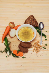 broth with bread and vegetables