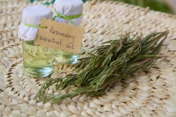 Rosemary essential oil and rosemary twigs