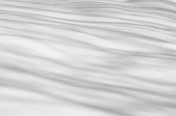 Fototapeta na wymiar Snow background with shadows from trees
