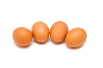 brown chicken eggs isolated on white background