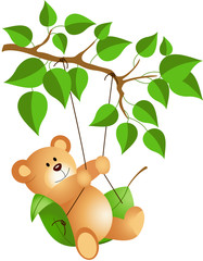 Teddy bear swinging from a tree