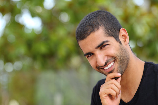 Portrait of a handsome arab man face outdoors