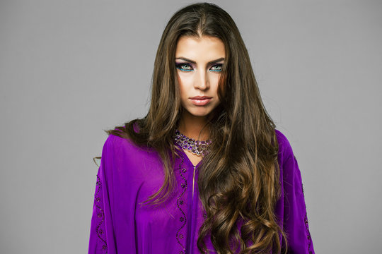 Portrait of the young sexy woman in purple  tunic Arabic