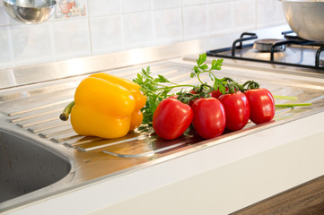 Yellow peppers, red tomatoes and parsley
