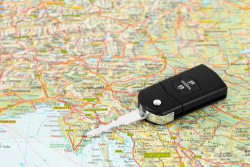 Car key on street map travel concept
