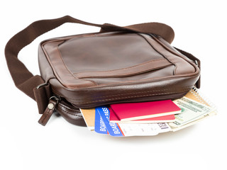 Brown messenger bag with travel document
