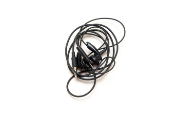 Tangled headphones isolated on a white background