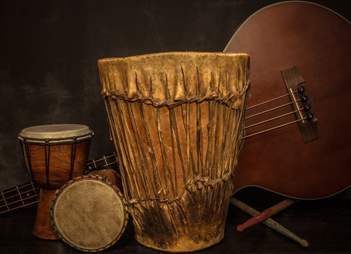 old music instruments -Djembe drums and acoustic bass guitar