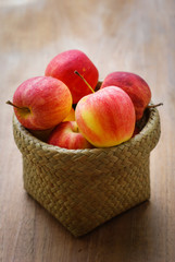 Juicy fresh apples on dark wooden background