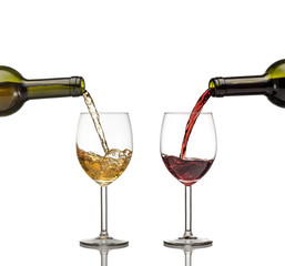 Red and white wine being poured into wine glass on white backgro