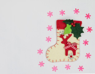Christmas decorations and sock on white