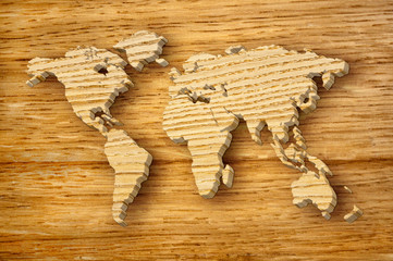 world map carving on wood plank