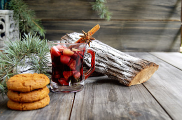 cup of hot Christmas mulled wine with cake
