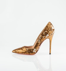 Obraz premium Golden women shoe