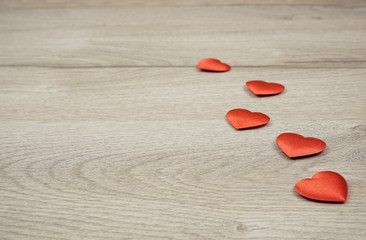 Hearts on the wooden background