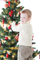Boy decorating Christmas tree