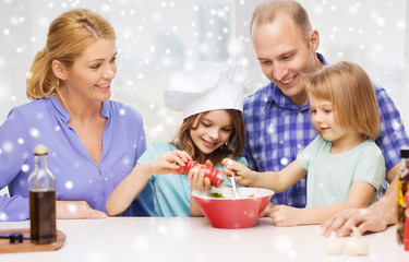 happy family with two kids making salad at home