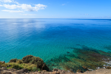 Fototapeta na wymiar Beautiful colours of ocean on coast of Fuerteventura island