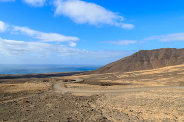 Fototapeta na wymiar Unpaved road to Cofete beach, Fuerteventura, Canary Islands