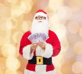 man in costume of santa claus with euro money