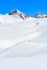 Fototapeta na wymiar Snow covered mountains in winter ski resort of Pitztal, Austria