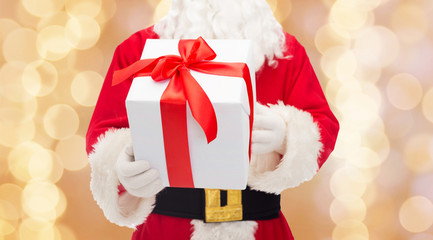 man in costume of santa claus with gift box