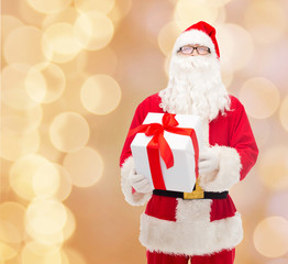 man in costume of santa claus with gift box