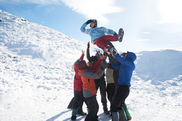 group of hikers have fun in winter mountains
