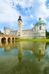 Reflection of Krasiczyn castle in a lake in summer, Poland