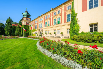 Fototapeta na wymiar Gardens of beautiful Lancut castle on sunny summer day, Poland
