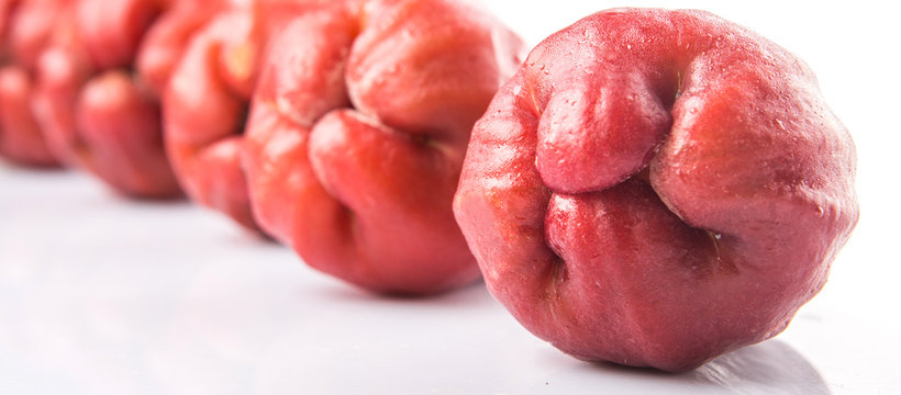 The exotic rose apple fruit over white background