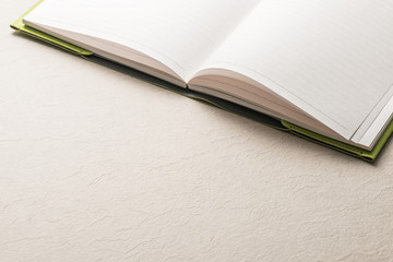 Notebook.Office supply on Empty Desk.