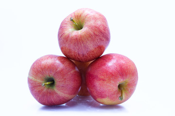 Fototapeta na wymiar Red apple with leaf and slice on a white background.