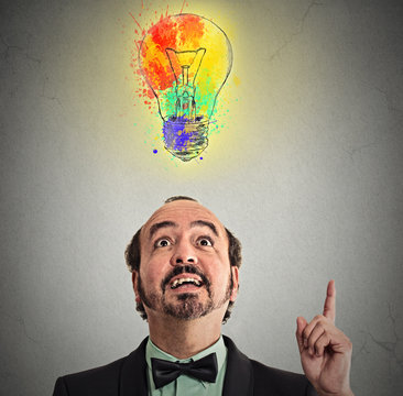 Creative business idea with colorful lightbulb grey background 