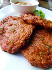Close-up of a plate of freshly cooked Thai fish cakes