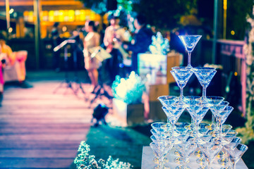Glasses of champagne are lined up in wedding celebration