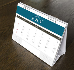 July Calendar  2015 on wood table