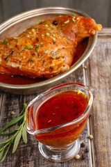 Honey and pepper red marinade in glass gravy boat