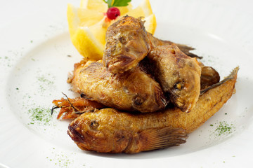 The breaded fish in corn with lemon